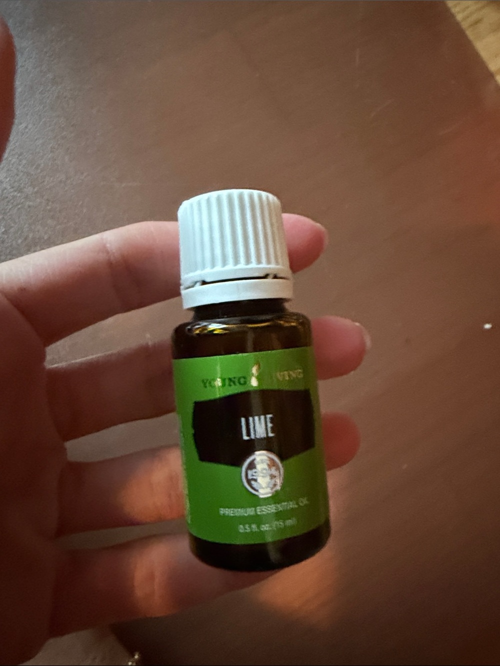 Young Living Lime Essential Oil Bottle with White Cap and Green Label